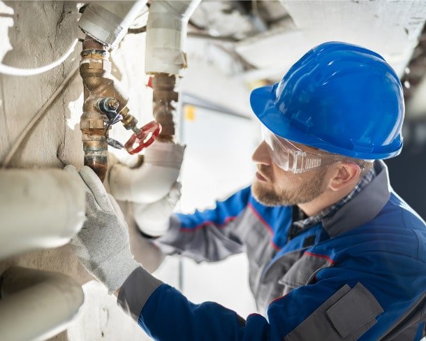 male-worker-inspecting-valve-picture-id1204813771-min