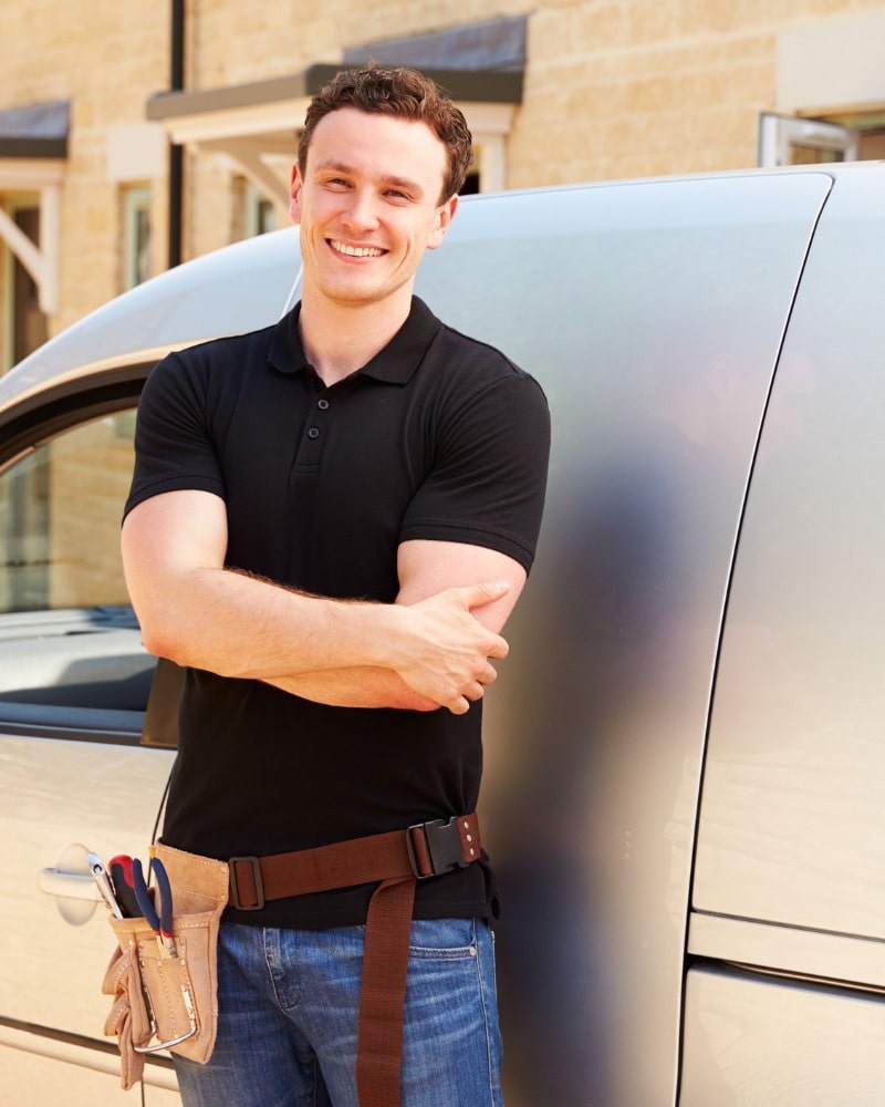 portrait-of-a-young-tradesman-by-his-van-picture-id488756852-min
