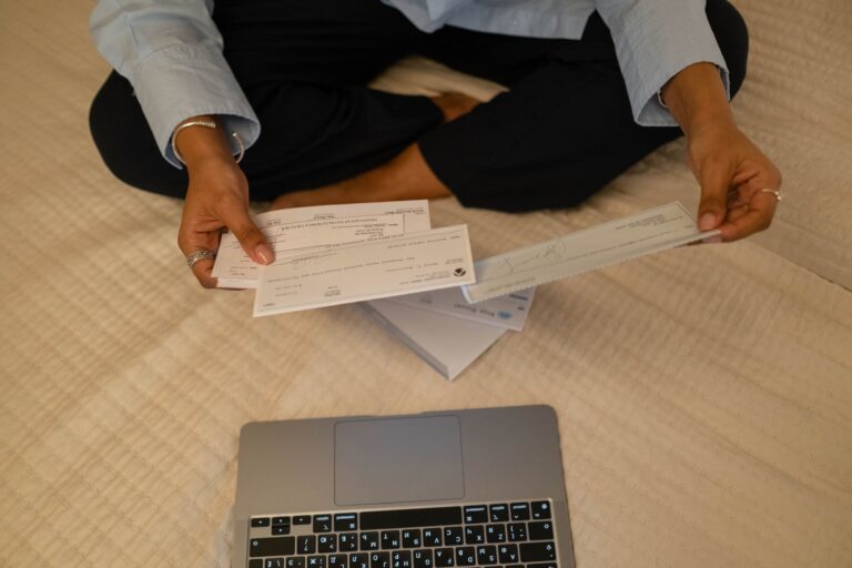 a woman looking at the water bill which is higher than usual